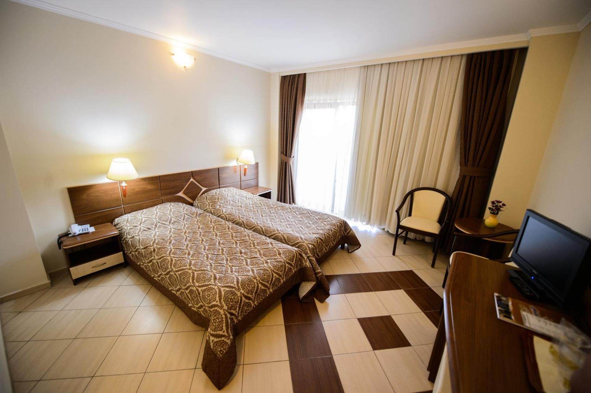 Holiday Olimp Hotel Rum bild