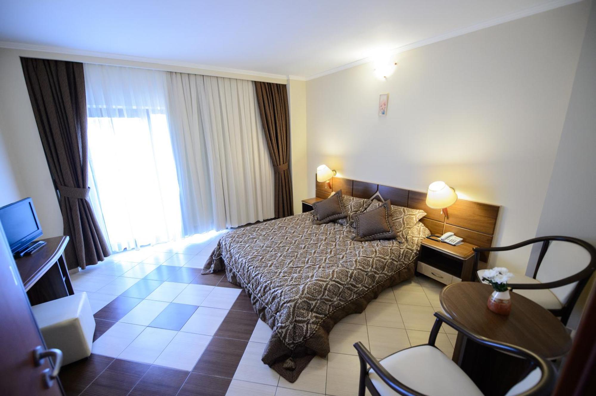 Holiday Olimp Hotel Rum bild